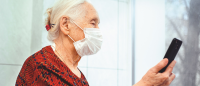 Elderly woman doing telehealth.